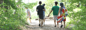 Young campers hiking down the trail.